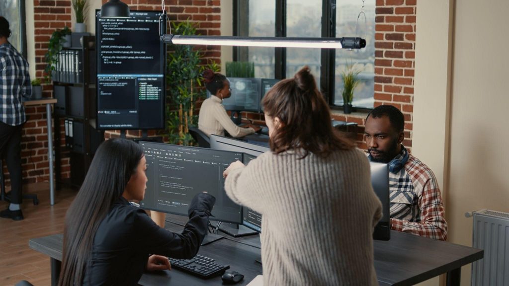 How to Choose the Right Custom Web App Development Services? 3 Employees working in a company