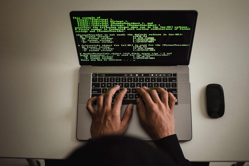 How ElectronJS Works: An In-Depth Look at This Powerful Framework 2 A guy coding on his laptop